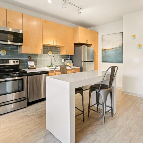 a kitchen with wooden cabinets