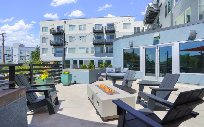 A rooftop patio with firepit