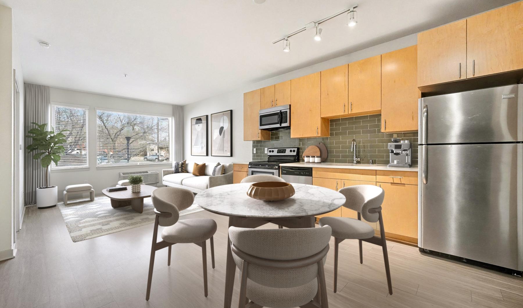 a kitchen with a table and chairs