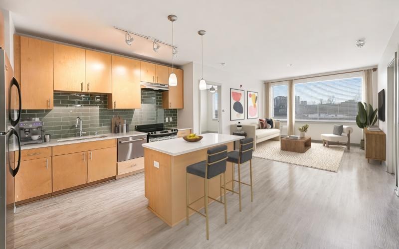 a kitchen with a bar and chairs
